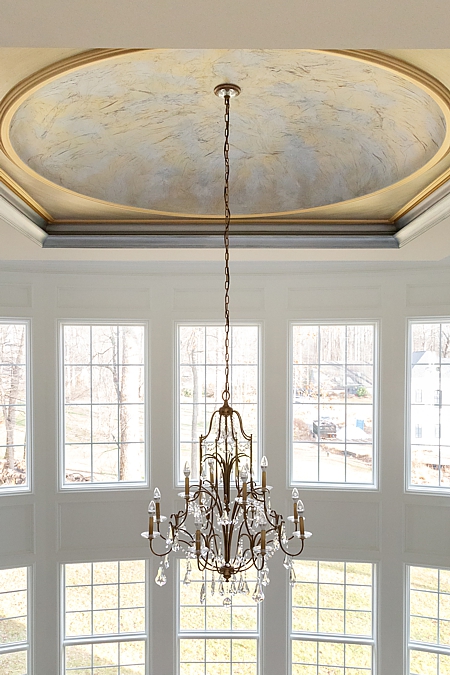 natural light from the dramatic windows and a stunning crystal chandelier for evenings.